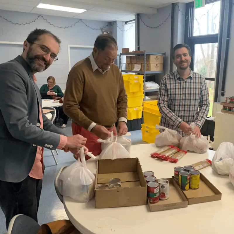 Community members packing food at St. Francis Episcopal Parish & Community Center.